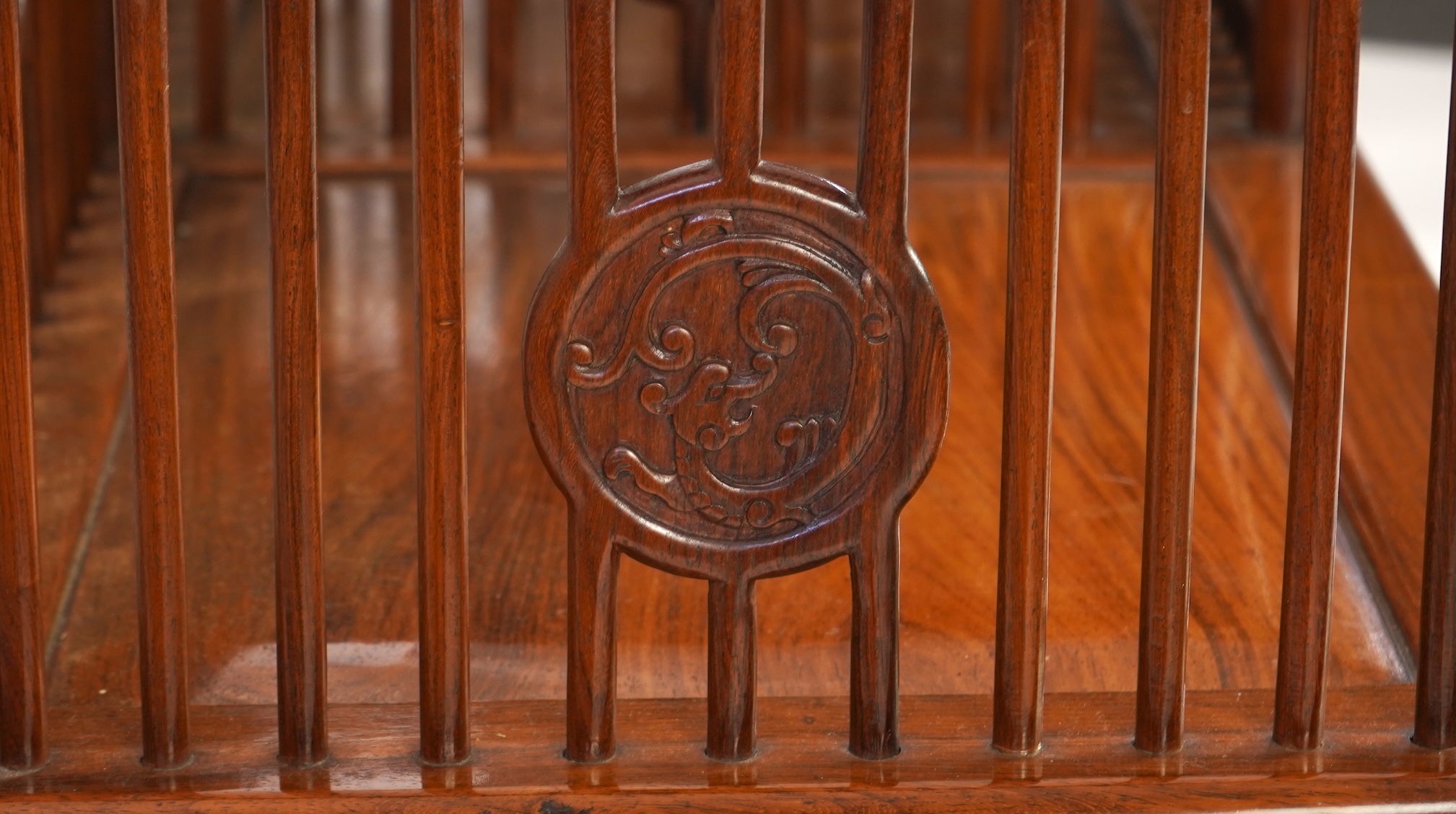 A Chinese hardwood and burrwood inset spindle-back bench, early 20th century